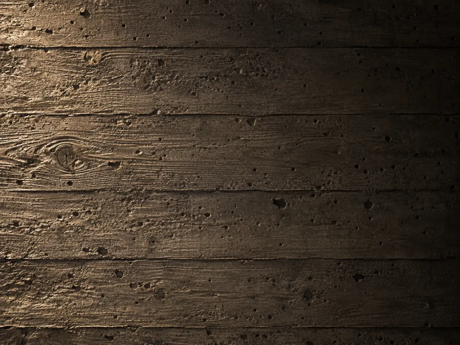 Board-formed concrete bearing the grain of the cedar planks it was cast against